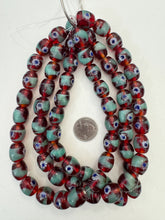 red green blue white, dotted swirl motif, vintage stock glass, 17x14mm barrel, 15" strand, SOLD PER STRAND