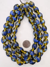 dark green yellow blue white, dotted swirl motif, vintage stock glass, 20x14mm bowed tube, 15" strand, SOLD PER STRAND
