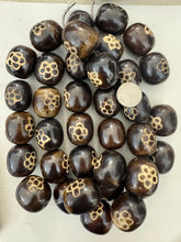 dark brown off white flower motif, faux bone, vintage look resin, 33x29mm barrel, 15" strand, sold per strand
