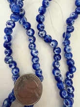 blue white, floral dotted motif, vintage stock glass, 7mm round mix, 15" strand, SOLD PER STRAND