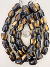 brown off white stripe motif, faux bone, vintage look resin, 23x19mm barrel, 15" strand, sold per strand