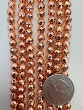 copper plated hematite, 6mm faceted round, 15" strand,  SOLD PER STRAND