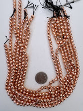 copper plated hematite, 6mm faceted round, 15" strand,  SOLD PER STRAND