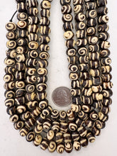 dark brown off white, spiral motif, vintage stock bone, 12x8mm rondelle, 15" strand, sold per strand