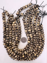 dark brown off white, spiral motif, vintage stock bone, 12x8mm rondelle, 15" strand, sold per strand