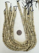 off white grey, carved lines motif, vintage stock bone, 8-10mm barrel size mix, 15" strand, SOLD PER STRAND
