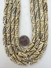 off white, carved dark dots lines motif, vintage stock bone, 21x8mm tube, 15" strand, sold per strand