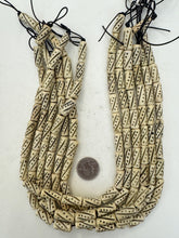 off white, carved dark dots lines motif, vintage stock bone, 21x8mm tube, 15" strand, sold per strand
