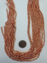 copper plated hematite, 3x2mm faceted rondelle, 15" strand,  SOLD PER STRAND