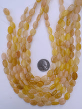 yellow jade, 14x9x5mm oval, 15" strand, sold per strand