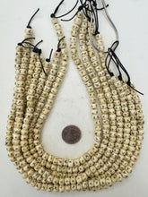 off white brown black, carved x motif, vintage stock bone, 8x6mm rondelle, 15" strand, SOLD PER STRAND