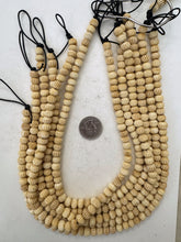 off white, carved lines motif, vintage stock bone, 9x7mm rondelle, 15" strand, sold per strand