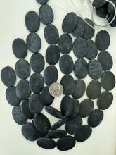 matte black stone, 35x25x5mm oval, 15" strand, sold per strand, surface wear