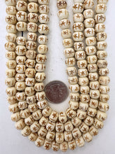 off white, carved dark lines starburst motif, vintage stock bone, 10x8mm rondelle, 15" strand, sold per strand