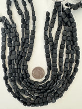 matte black stone, 8x8x4mm square, 15" strand, sold per strand, surface wear