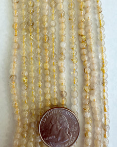 Golden rutilated quartz, 4mm round, 15" strand (mixed tone hank)
